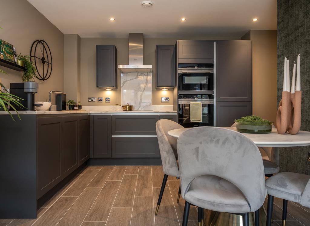 Dining area and kitchen of a Redrow apartment