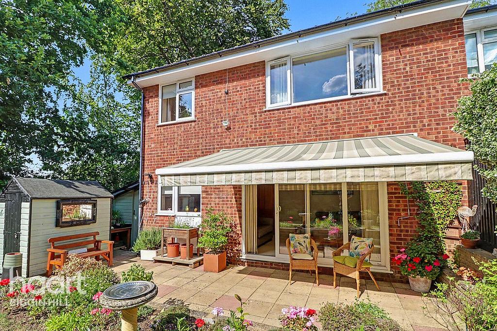Conservatory interior, french doors leading to garden