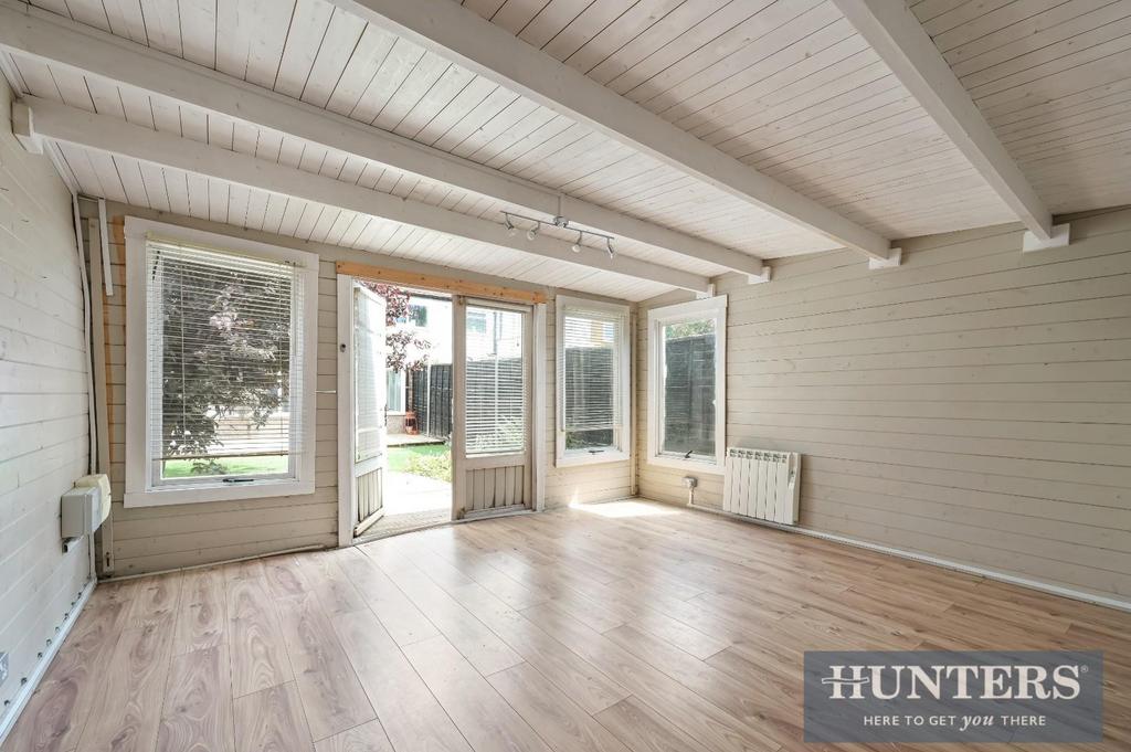 Conservatory interior, french doors leading to garden