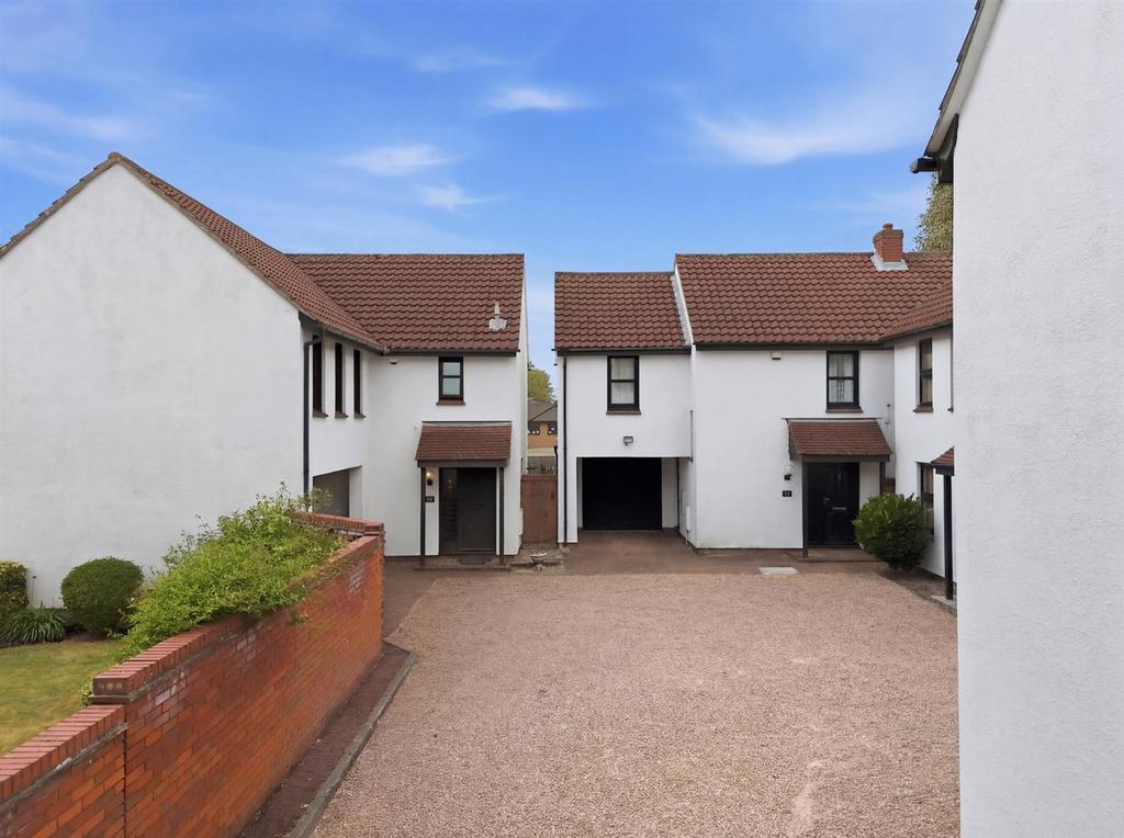 Street scene with property, garage