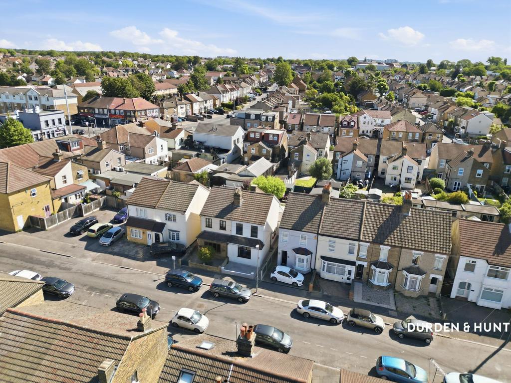 Street scene with property, parking