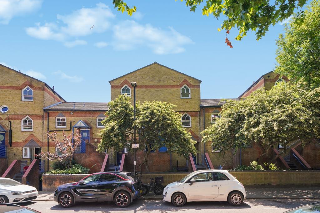 Street scene with property, parking