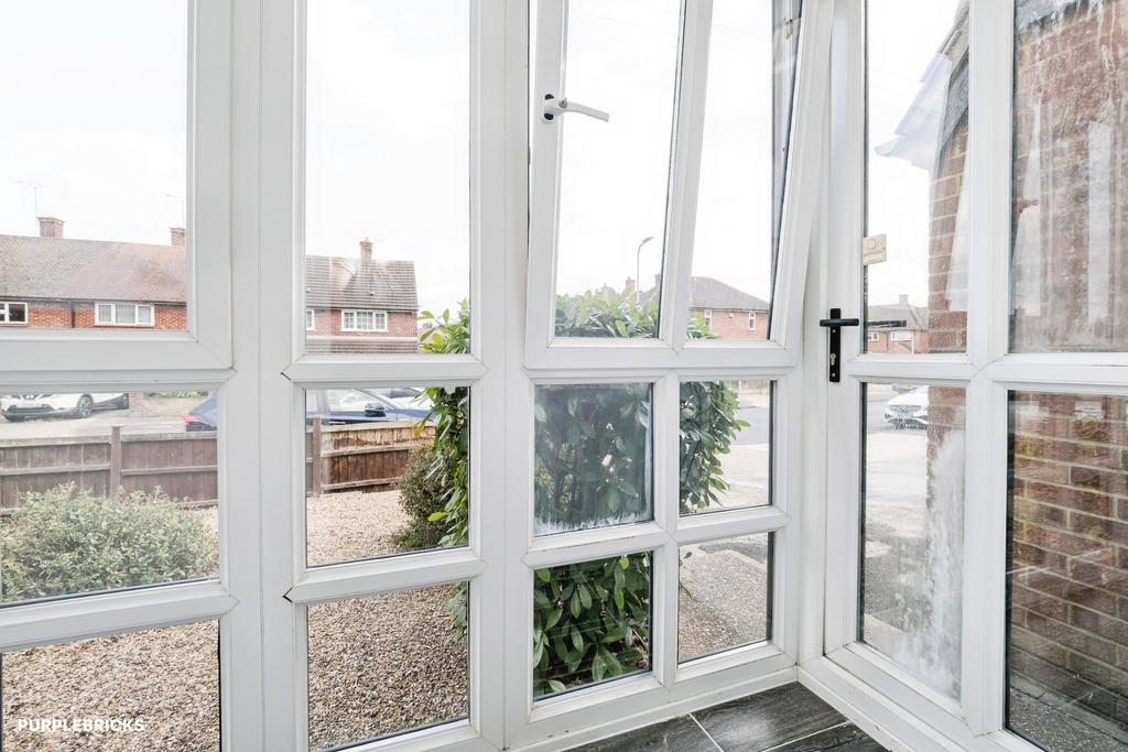 Conservatory interior, french doors leading to garden