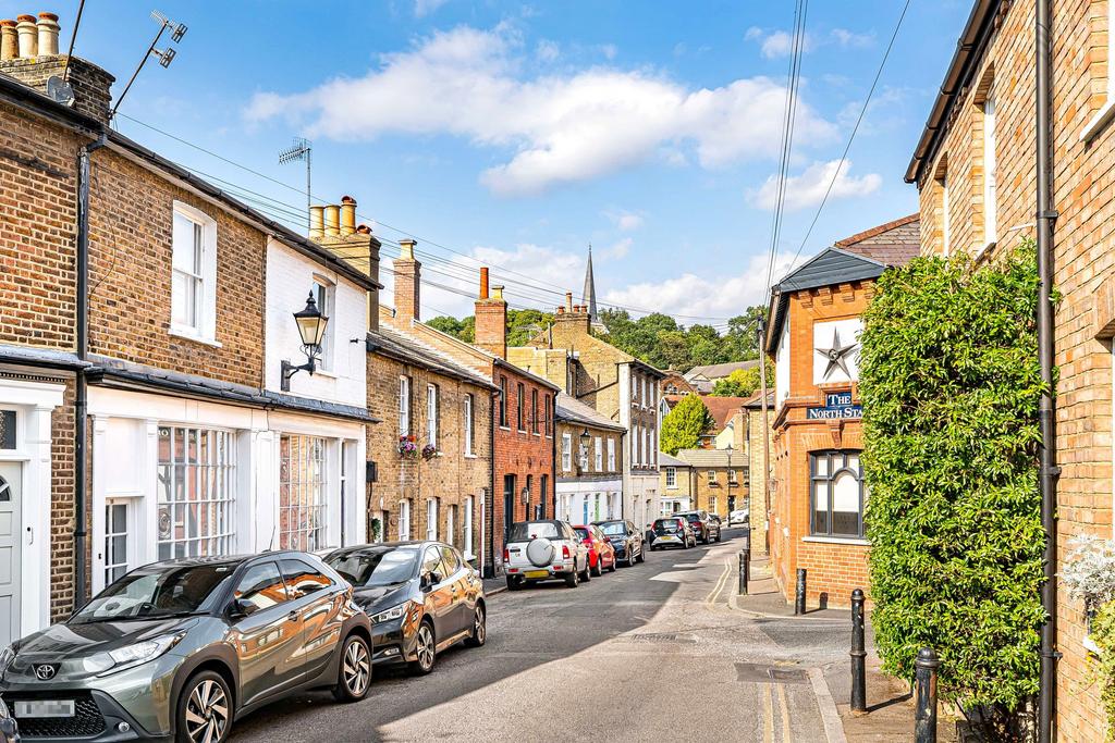Street scene with property, parking