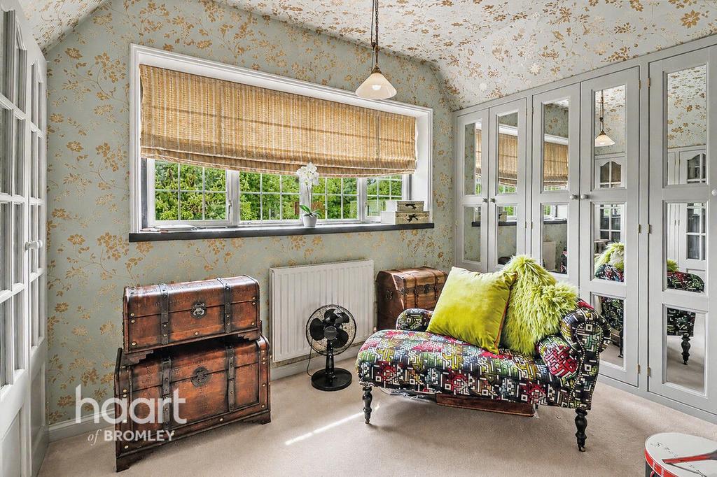 Conservatory interior, french doors leading to garden