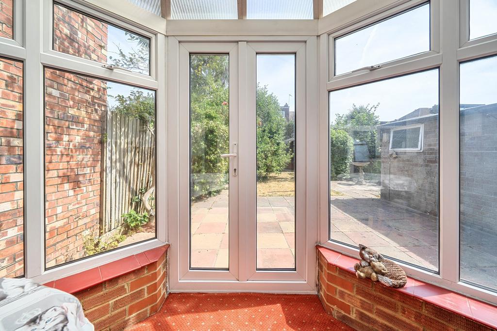 Conservatory interior, conservatory, french doors leading to garden