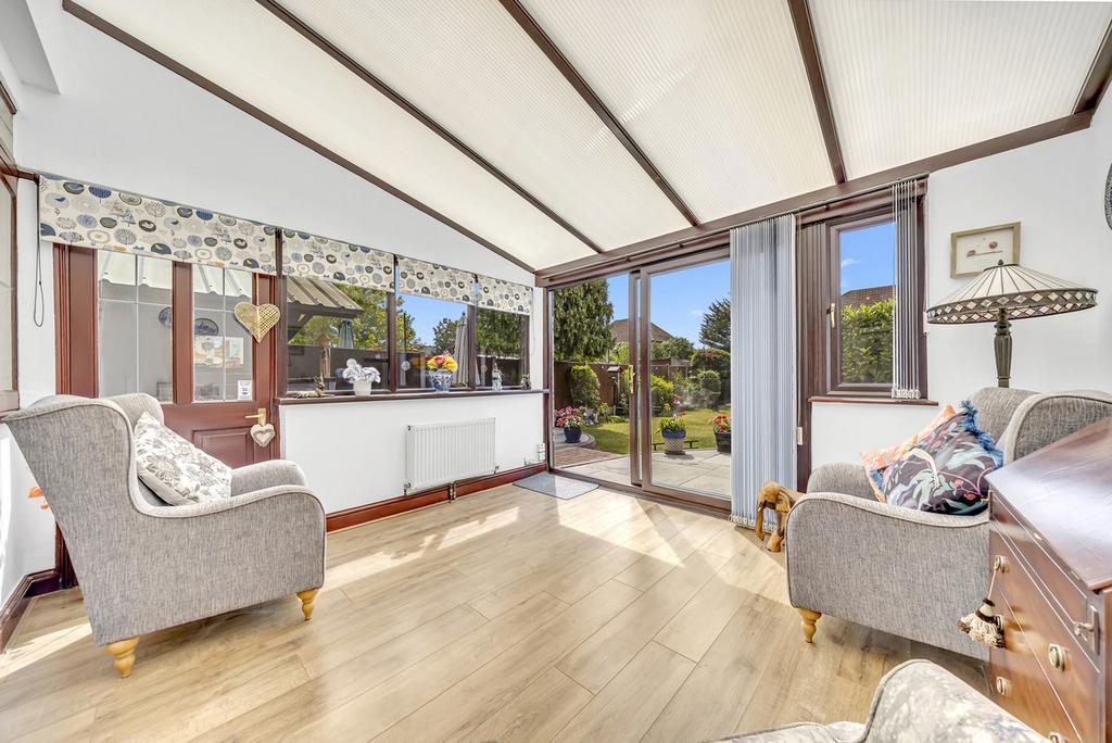 Conservatory interior, french doors leading to garden