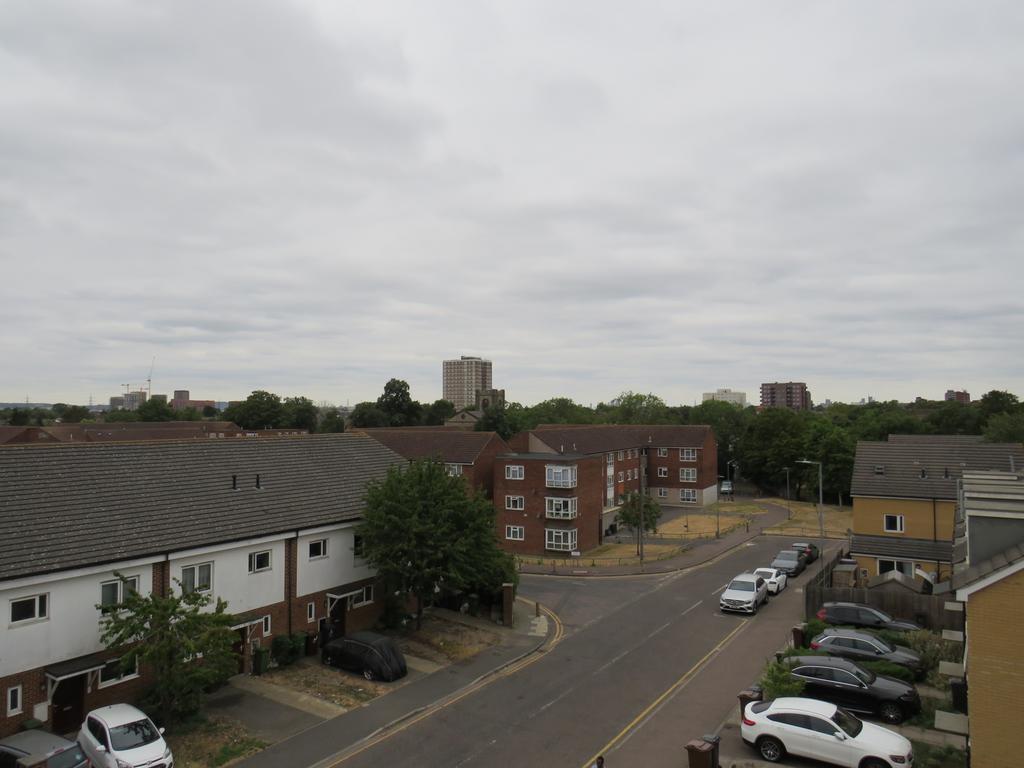 Street scene with property, parking