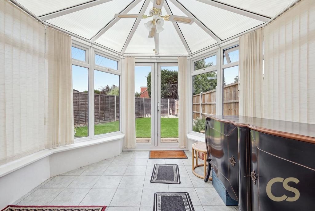 Conservatory interior, conservatory, french doors leading to garden