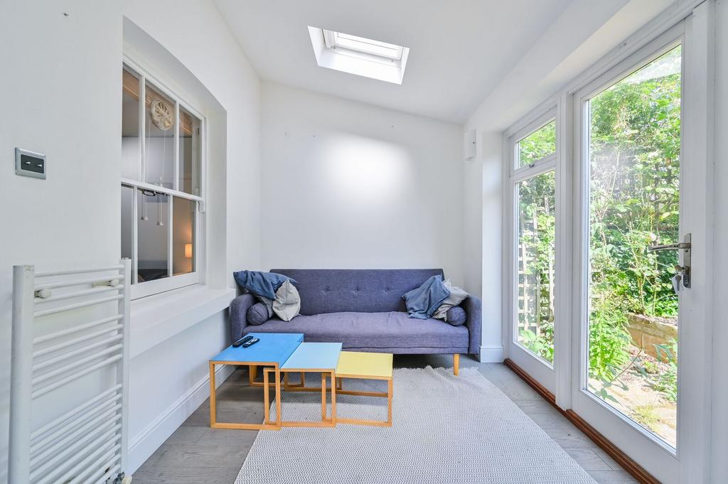 Conservatory interior, french doors leading to garden