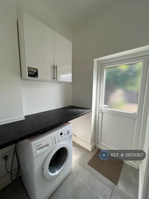 Utility Room With Access To Shower Room