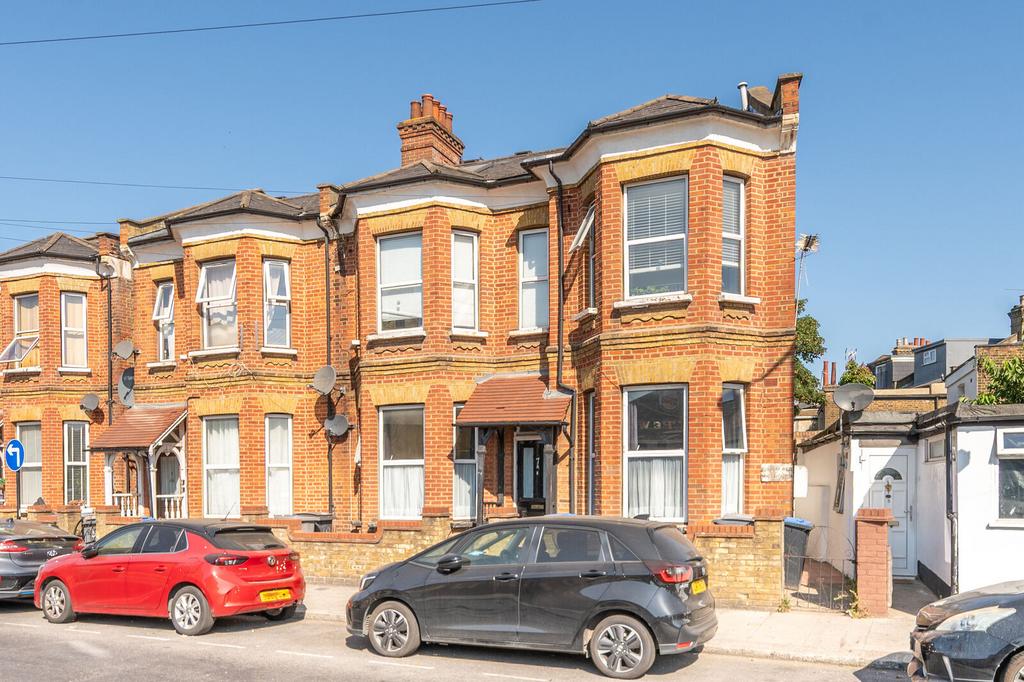 Street scene with property, parking