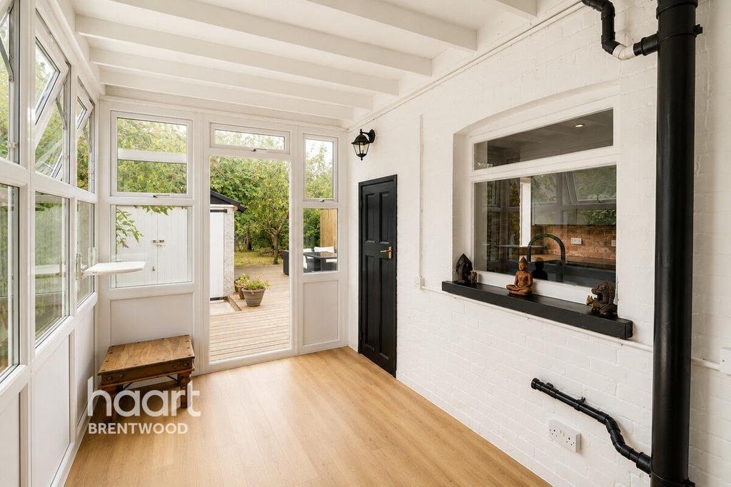 Conservatory interior, conservatory, french doors leading to garden