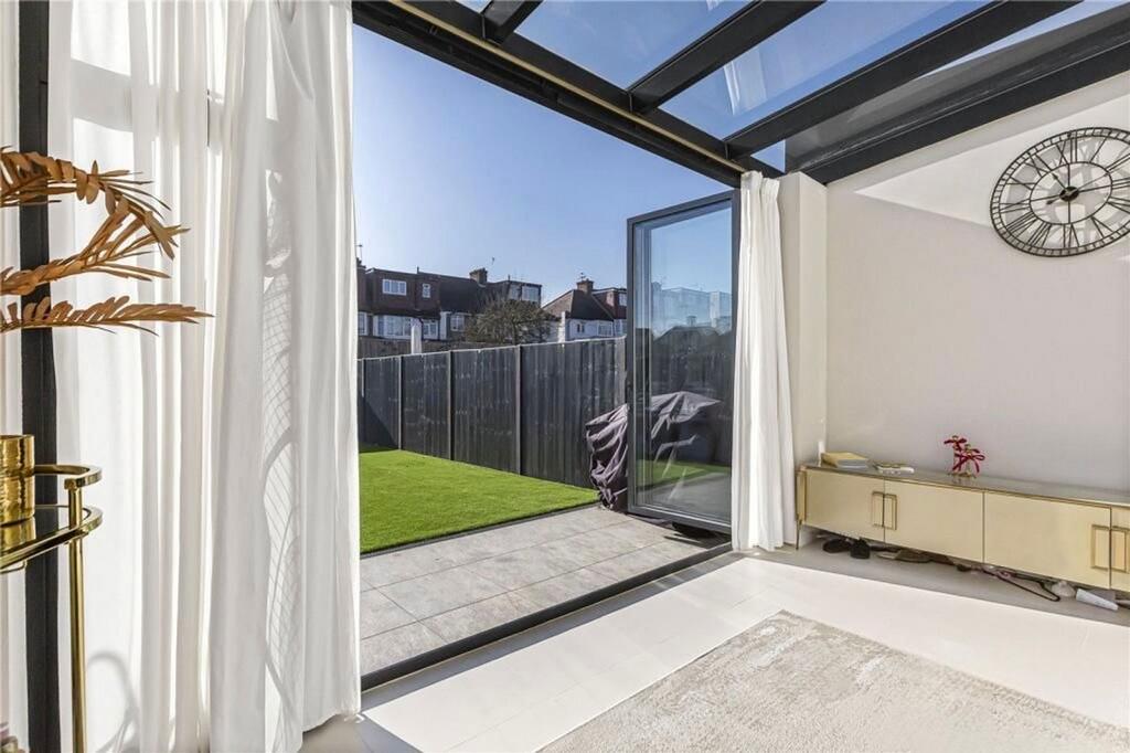 Conservatory interior, french doors leading to garden