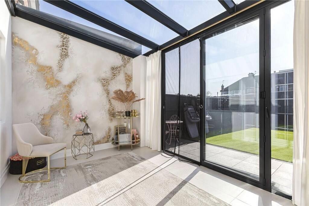 Conservatory interior, french doors leading to garden