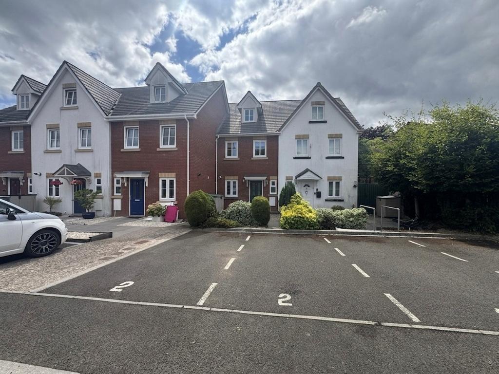 Street scene with property, parking