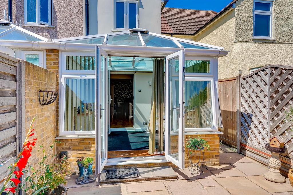 Conservatory interior, conservatory, french doors leading to garden