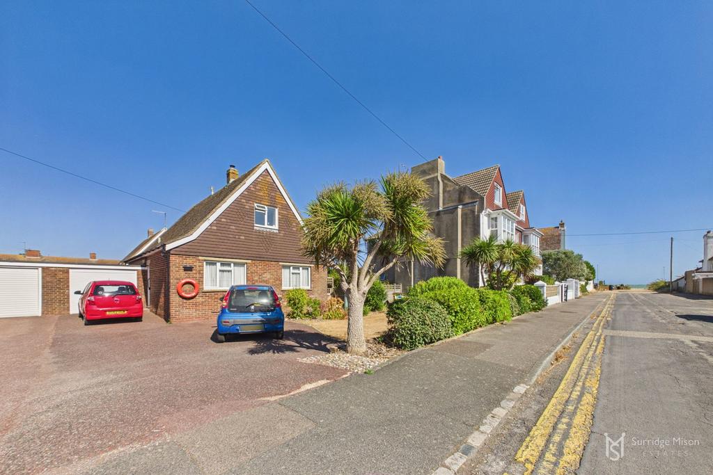 Street scene with property, garage