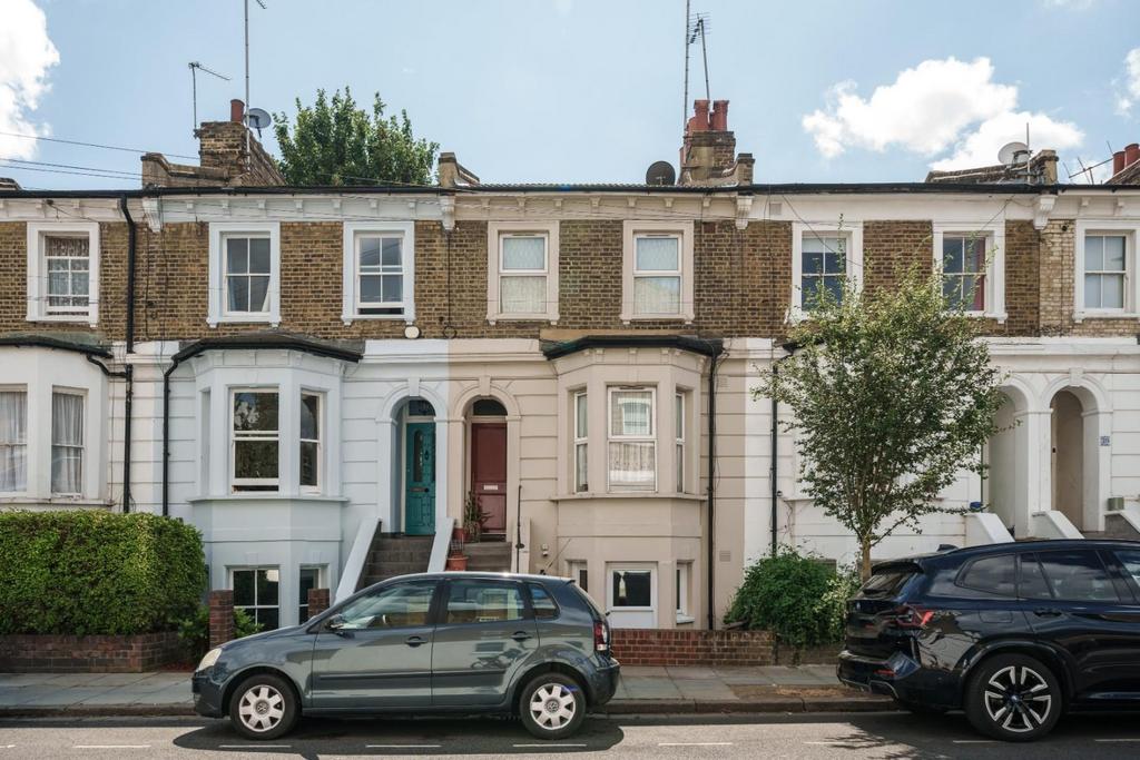 Street scene with property, parking