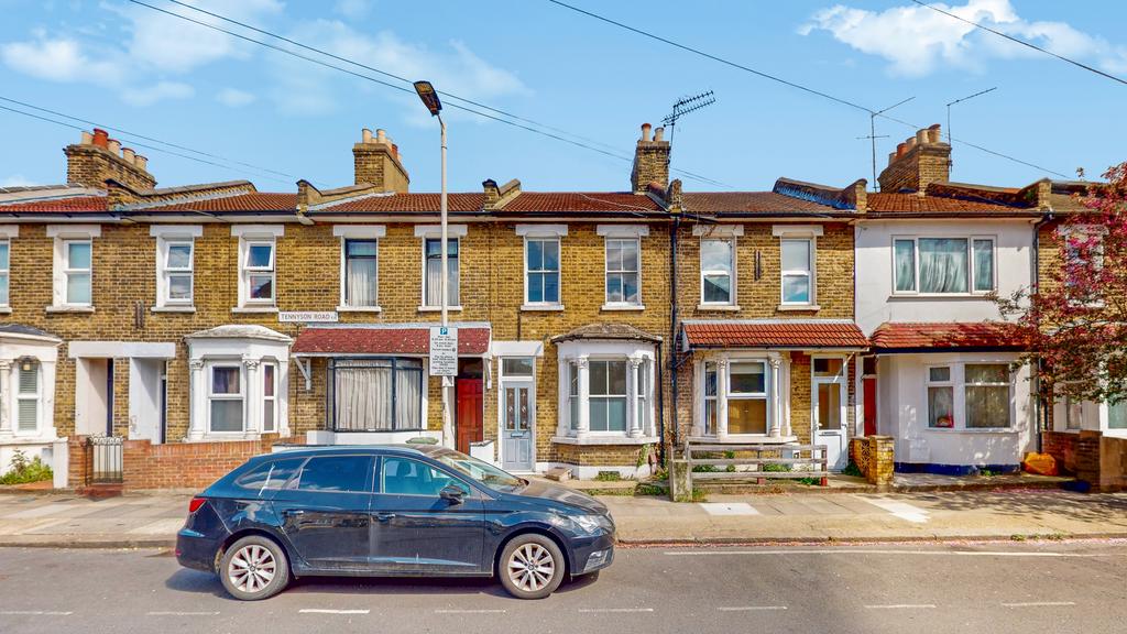 Street scene with property, parking