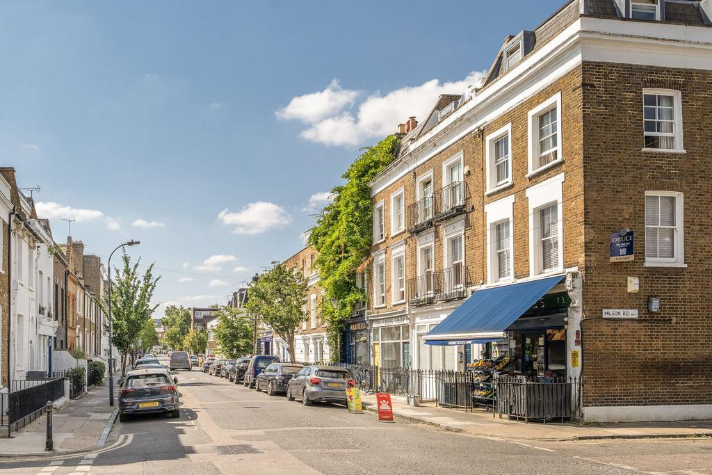 Street scene with property, parking