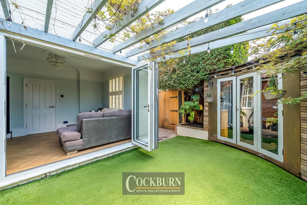 Conservatory interior, french doors leading to garden