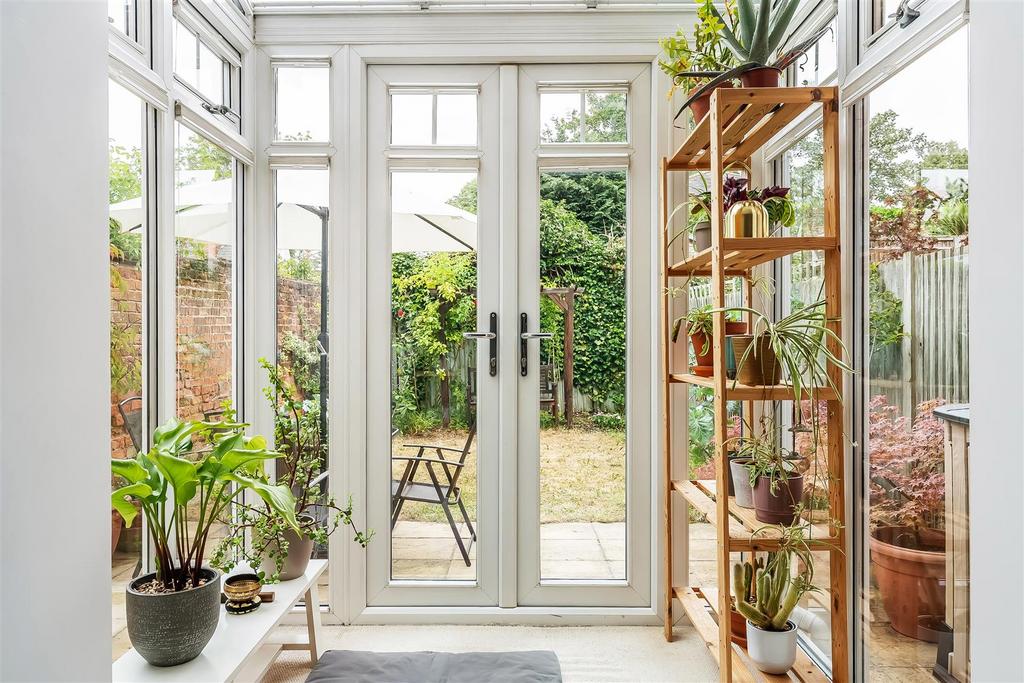 Conservatory interior, conservatory, french doors leading to garden