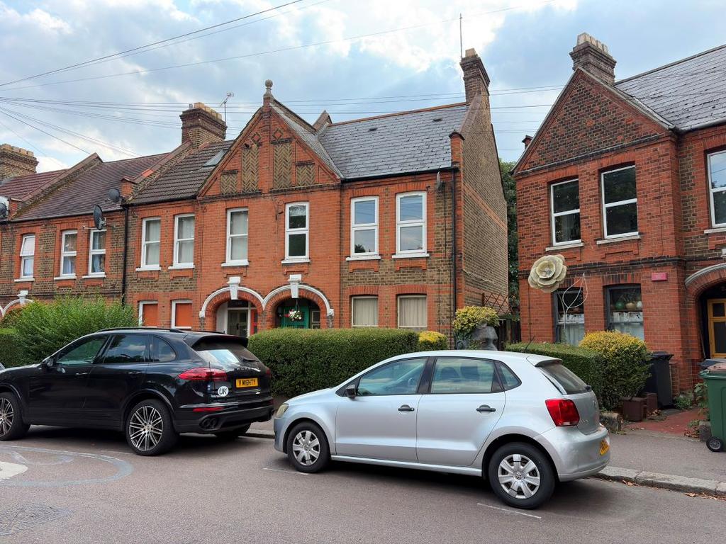 Street scene with property, parking