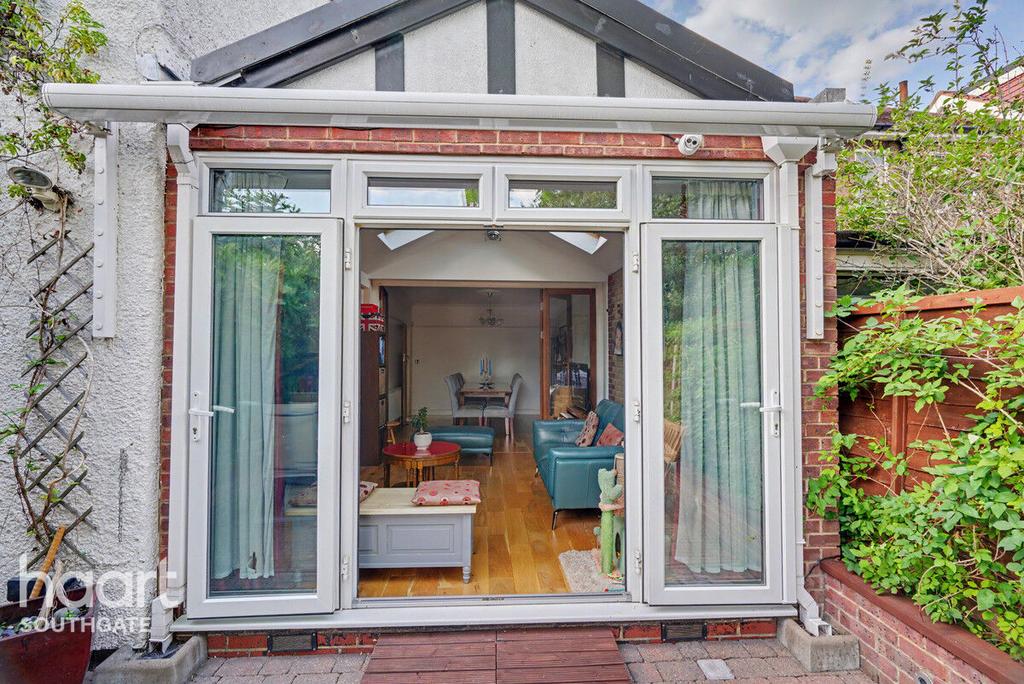 Conservatory interior, french doors leading to garden