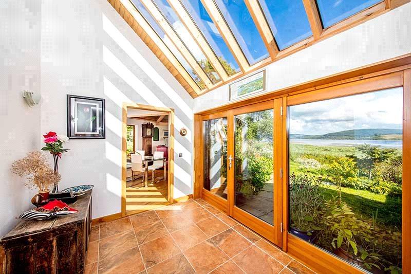 A glorious lochside home with magical views, private beach and its own