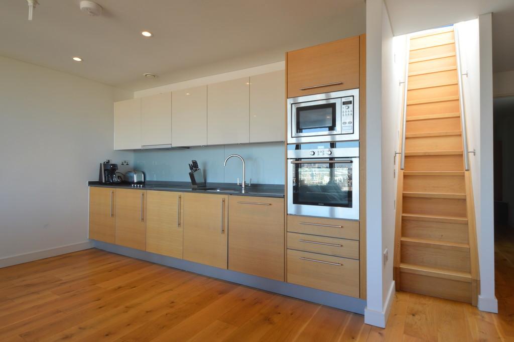 Kitchen and stairs to roof terrace