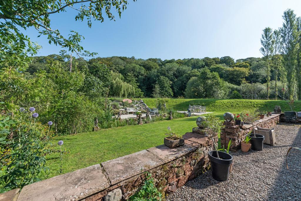 The terrace and lawn at Mill House