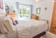 Light filled Bedroom with cupboard