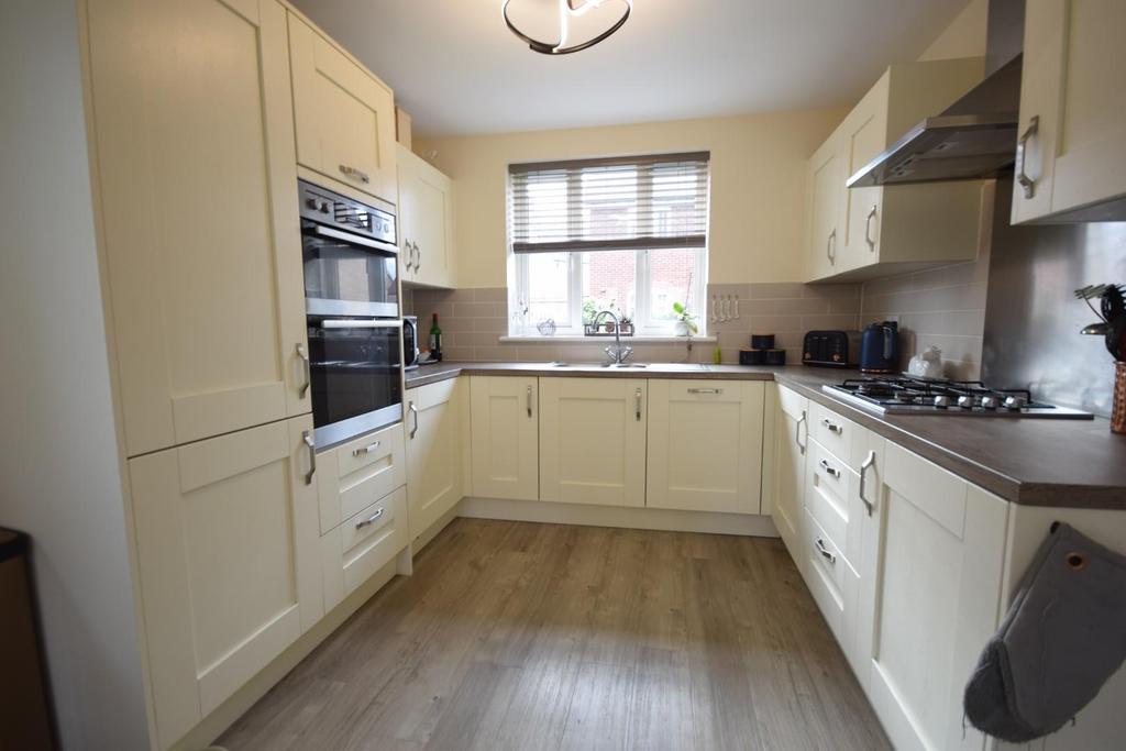 Kitchen through dining room