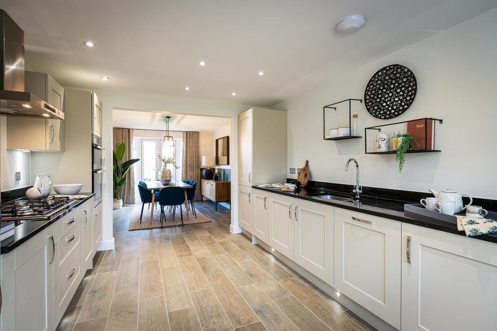 The open plan kitchen leads through double doors to a second reception room that could be used as a