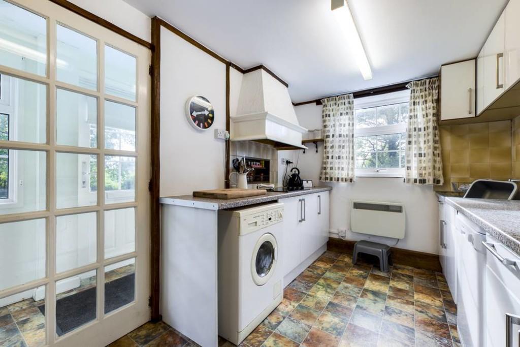 Kitchen with door to side porch
