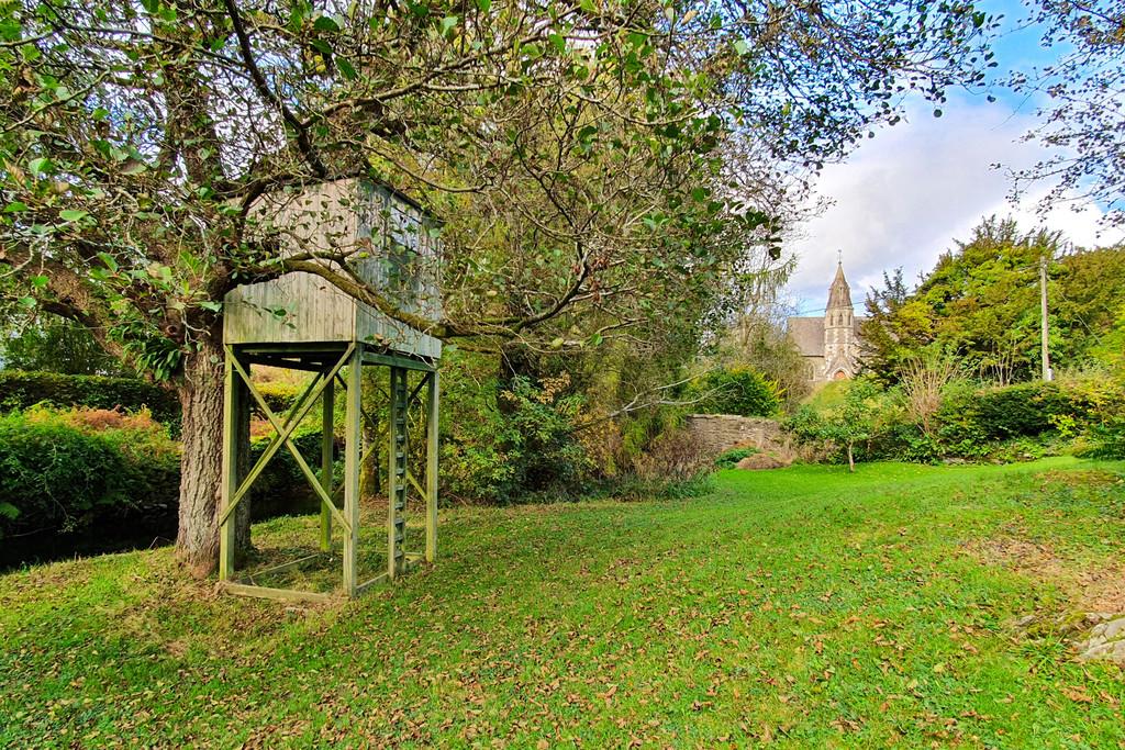 Tree house and aspect across to the church