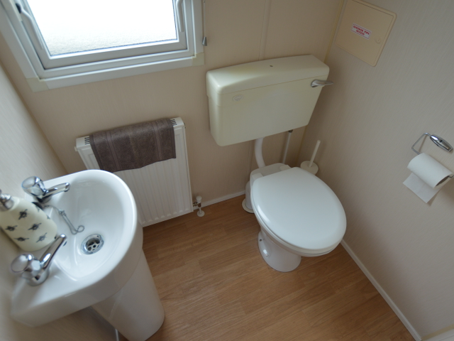 It has a compact yet stylish kitchen finished to t