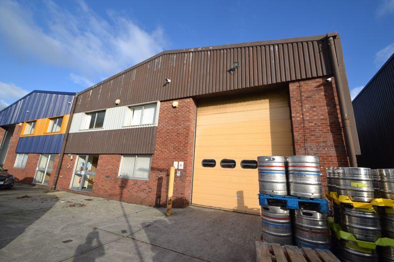 Large light industrial unit with offices and parking situated on the
